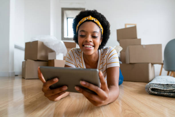 Happy Black renter in their new apartment, showcasing the positive impact of rent finance and financial flexibility in managing monthly rent.